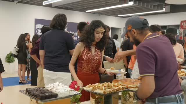 Office teams helping themselves at an MMK buffet